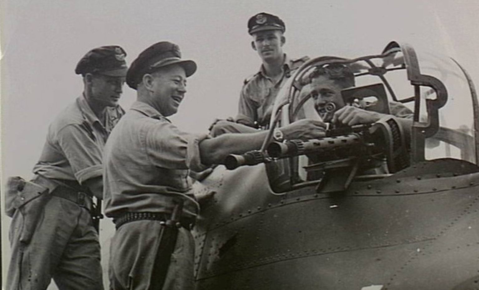 Just back from a night strike at Rabaul, the crew of an Australian made Beaufort bomber of No. 100 Squadron RAAF leaving their aircraft from the dorsal turret. Just back from a night strike at Rabaul, the crew of an Australian made Beaufort bomber of No. 100 Squadron RAAF leaving their aircraft from the dorsal turret.