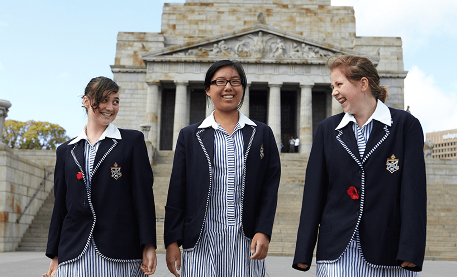 Three female school students walking at the Shrine of Remembrance Three female school students walking at the Shrine of Remembrance