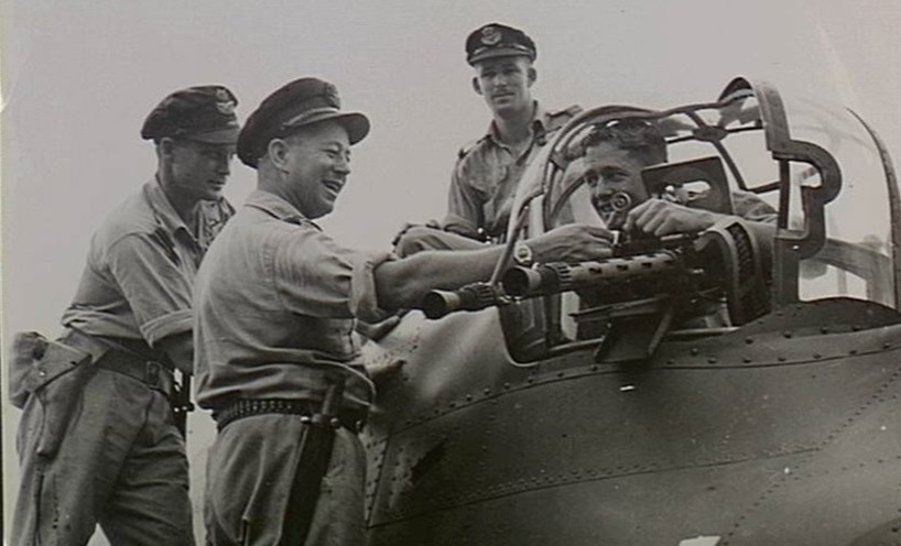 Just back from a night strike at Rabaul, the crew of an Australian made Beaufort bomber of No. 100 Squadron RAAF leaving their aircraft from the dorsal turret.