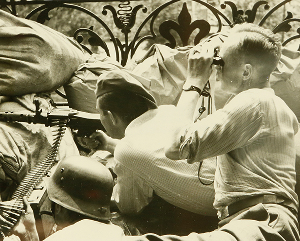 Polish Home Army soldiers man a machine gun nest during the Warsaw Uprising