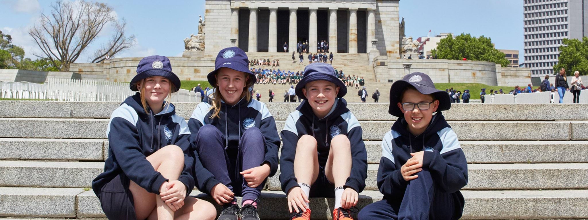 Shrine students on steps Primary students sit on steps of the Shrine of Remembrance