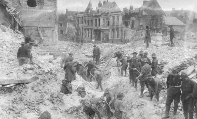 Australian troops search for survivors in the rubble of the Bapaume Town Hall 