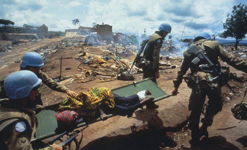 Four Australian soldiers carry a wounded woman on a stretcher April 1995