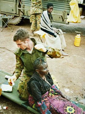 Lance Corporal Jenkins treats a refugee woman’s head wound May 1995