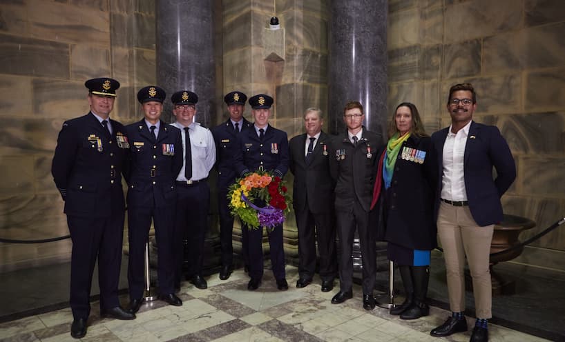 DEFGLIS members and friends at the Shrine of Remembrance Sanctuary pictured with a Rainbow Wreath