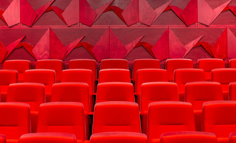 A row of red seats in the Shrine auditorium