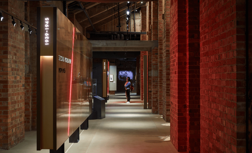 A person looks at a display in the Shrine's expansive Galleries