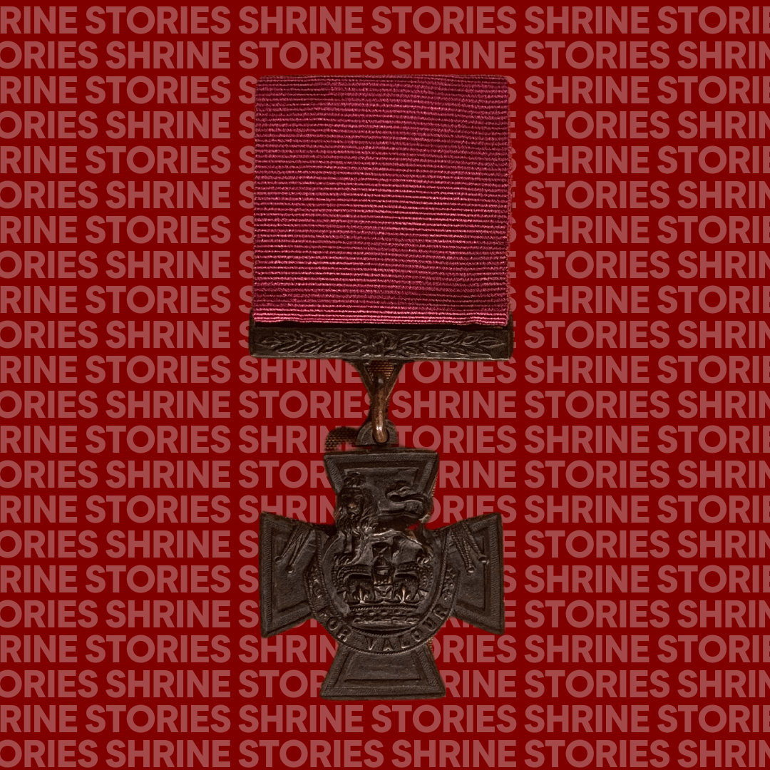 A Victoria Cross medal against a red backdrop with the words 'Shrine Stories' repeated over it. The medal has a red ribbon, and leaf detail on the top fascinator. The medal itself is a small cross with a crown and a lion, and the words 'For Valour' on it.