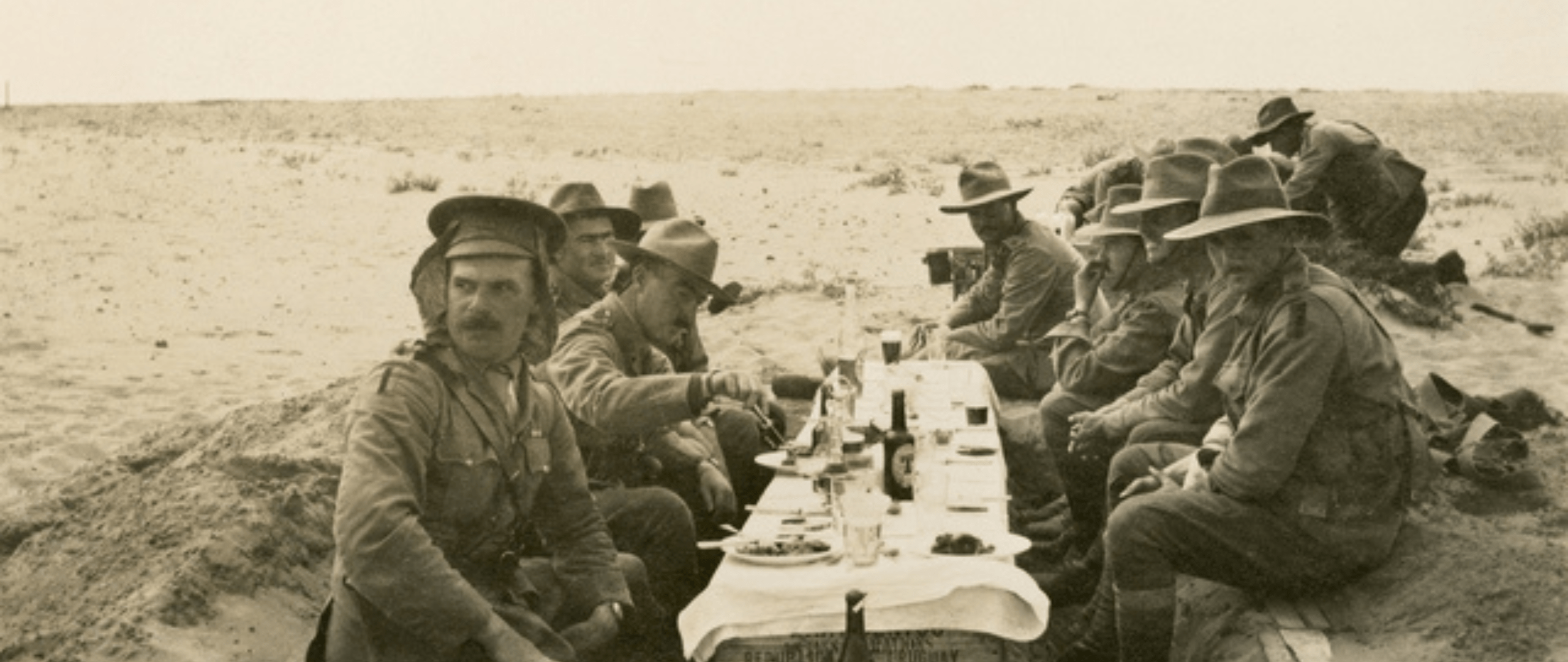 Soldiers at makeshift table in desert 1914-1918