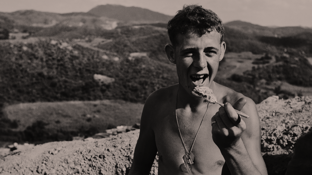 A soldier eats whilst on duty in Korea, 1952